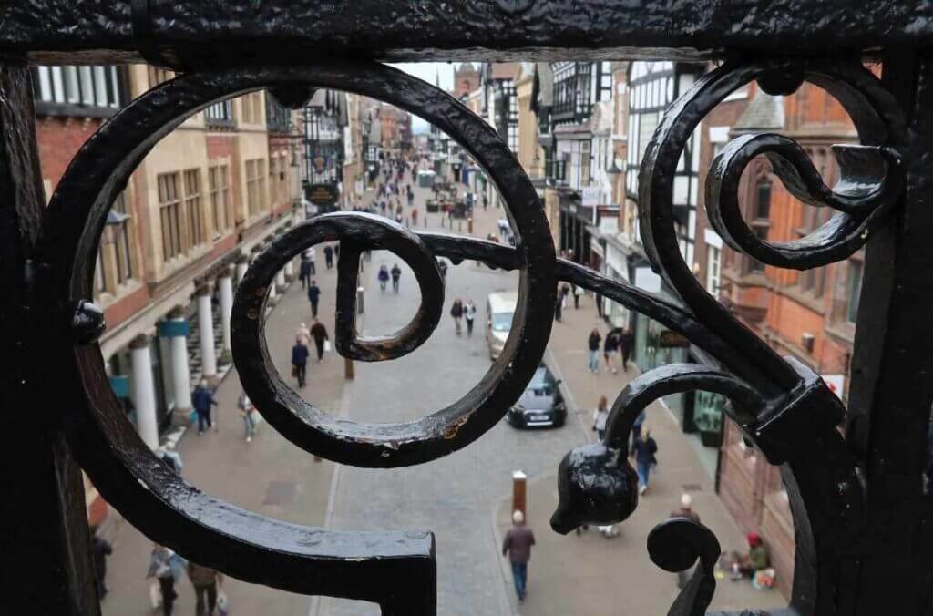 A view of historic Chester streets framed beautifully through ornate black iron gates, captured during a trip by the Golborne Photography Club.