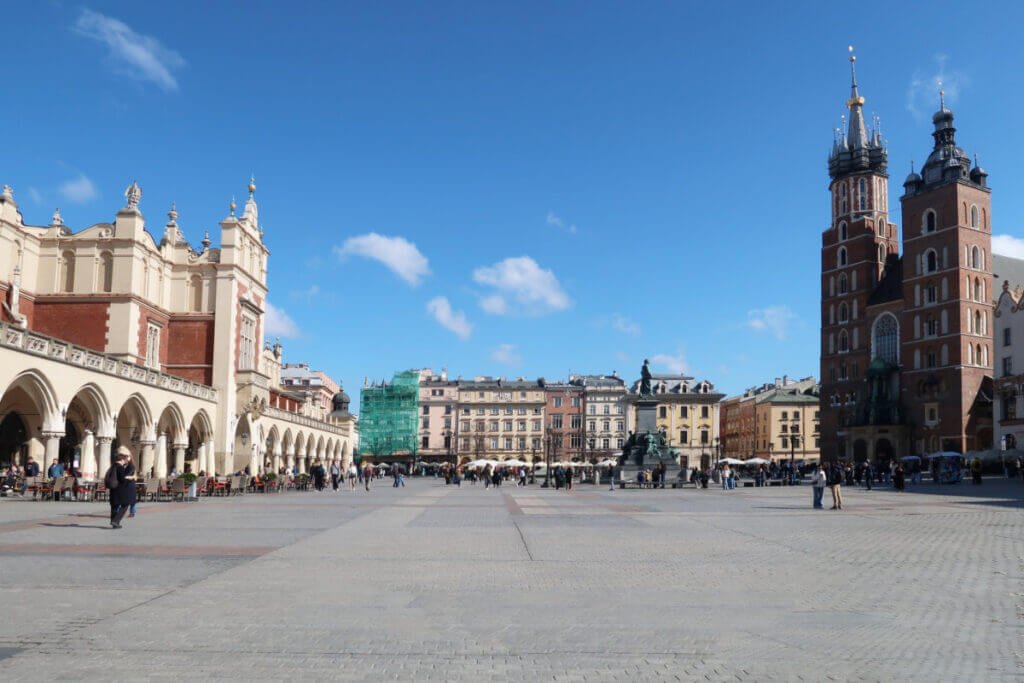 Main Market Square Rynek Glowny with the Cloth Hall and St Marys Basilica in Krakow.